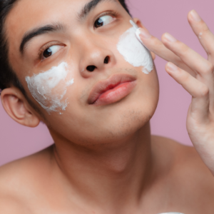 a man moisturizing during the steps of his skin care routine