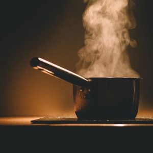 Pot of boiling water creating steam for at home spa day