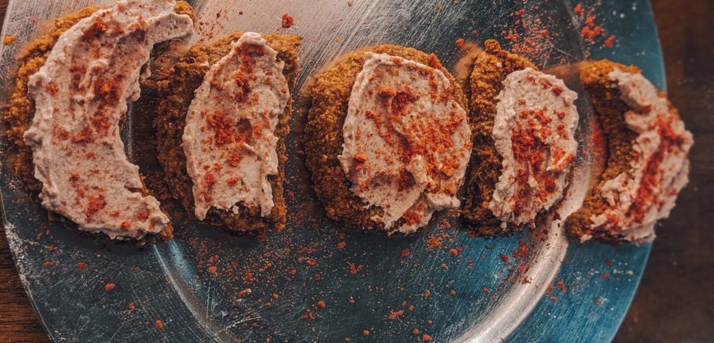 Vegan Full Moon Cookies frosted with Strawberry Flavored Coconut Cream in a moon cycle pattern