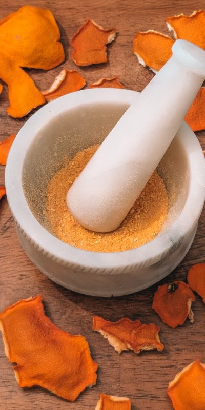 a natural vitamin C exfoliant made with orange peel in a mortar